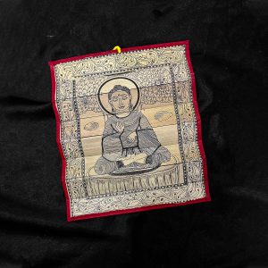 Palm leaf engraving of meditating Buddha