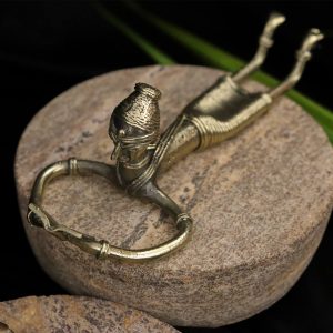 Dhokra Art of a Tribal Lady Reading a Book in Sleeping Posture.