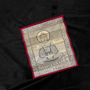 Palm leaf engraving of meditating Buddha